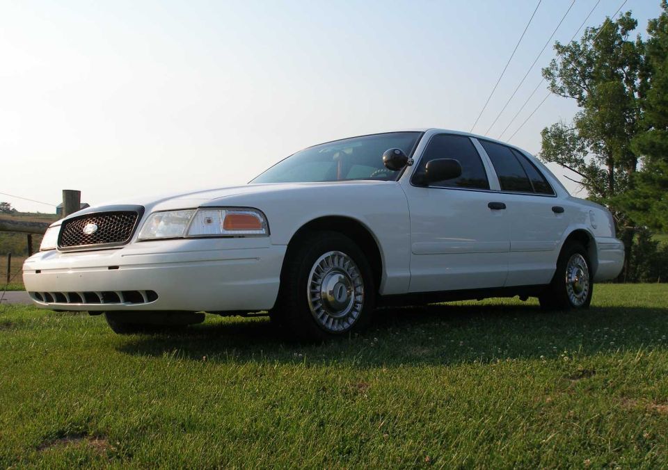2001 Ford Crown Victoria parked on grass, front quarter view