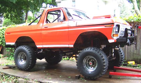 1978 Ford Bronco - This lifted orange Ford Bronco sits high on large off-road tires.