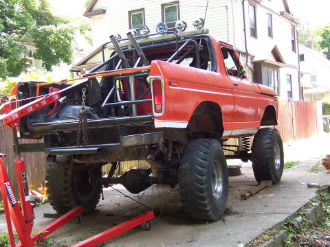 1978 Ford Bronco - This heavily modified 1978 Ford Bronco features a custom roll cage and oversized tires, suggesting it's built for off-road performance.