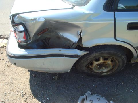 1996 Ford Bronco - This car has significant damage to its rear quarter panel and taillight.