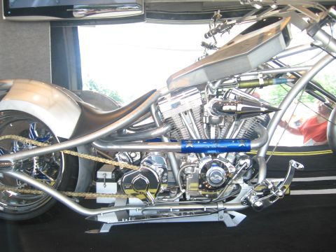 1988 Ford Bronco - Custom motorcycle features a V-twin engine, chrome frame, and a gold chain drive system.
