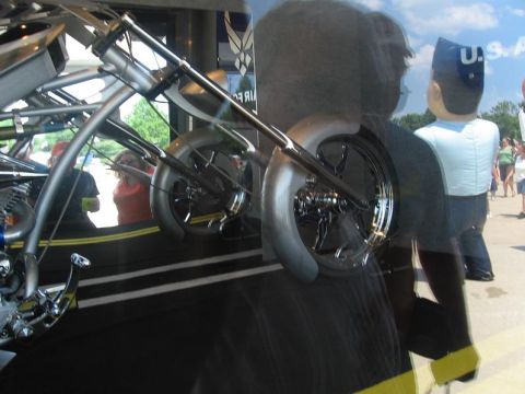 1988 Ford Bronco - A custom motorcycle with prominent chrome detailing is displayed, possibly at an event.