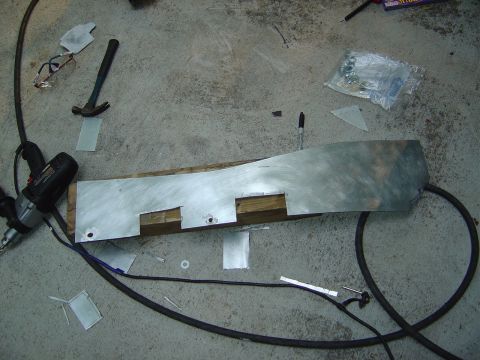 1986 Ford Bronco - Metal fabrication in progress, with tools and materials laid out on a workshop floor.