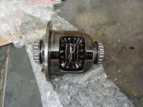 1992 Ford Crown Victoria - A close-up view of a differential, showing its internal gears and bearings, partially covered in protective bubble wrap.