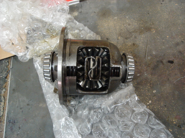 Differential with visible gears and bearings, wrapped in bubble wrap