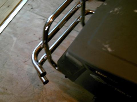 1986 Ford Bronco - A lawn mower with a chrome roll bar and dual exhaust pipes is visible.