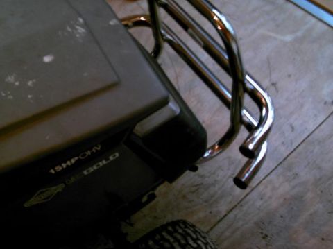 1986 Ford Bronco - A Briggs & Stratton Gold lawnmower features a 15 HP OHV engine and a custom chrome roll bar.