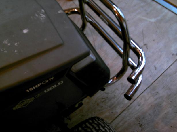 Close-up of a Briggs & Stratton Gold lawnmower with a chrome roll bar attached