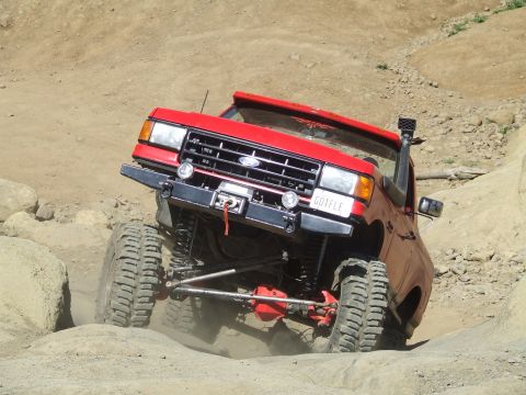 1979 Ford Bronco - This modified SUV navigates a rocky trail, its off-road capabilities.