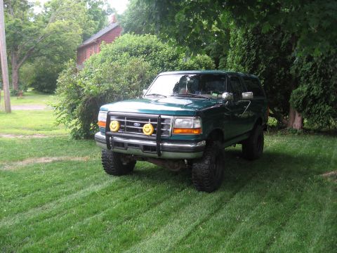 1996 Ford Bronco - Green 1996 Ford Bronco with custom smiley face lights on the front bumper.