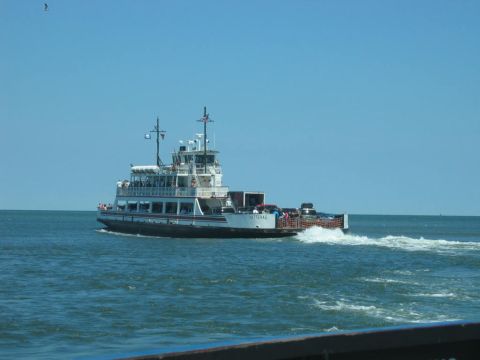 1985 Ford LTD Crown Victoria - A ferry boat named Hatteras travels across the water on a clear day.