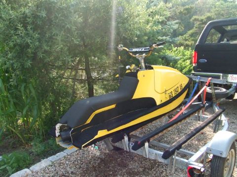 1998 Kawasaki JH1100-A4 1100 ZXi - Yellow jet ski on a trailer, parked near a black SUV. Registration number WGS 1547 AB is visible.