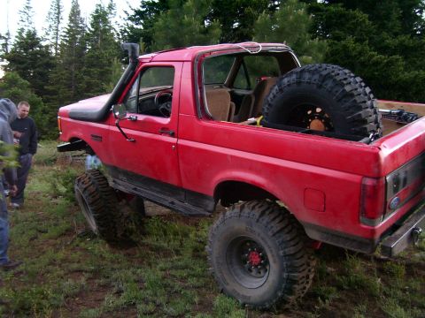 1989 Ford Bronco - This modified 1989 Ford Bronco is equipped for off-road adventures with a snorkel and a spare tire mounted in the bed.