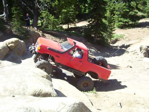 1989 Ford Bronco - This modified 1989 Ford Bronco navigates a challenging off-road trail.