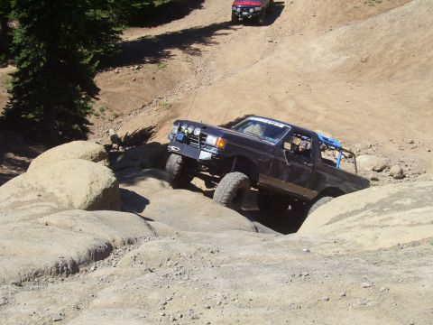 1989 Ford Bronco - This 1989 Ford Bronco is tackling a challenging rocky terrain on an off-road trail.