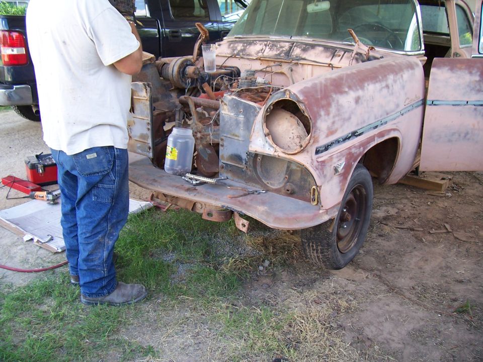 1955 Ford Customline front end with engine exposed and missing headlight