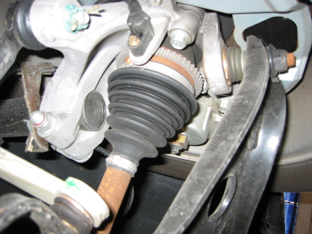 Underside view of front CV axle boot, aluminum knuckle and ABS tone ring