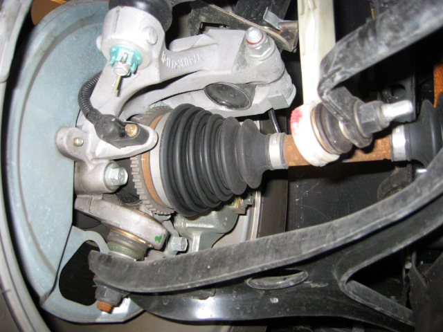Front CV axle boot, steering knuckle and ABS sensor on a front-wheel-drive car