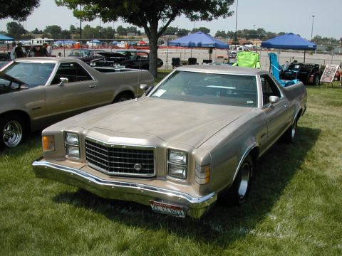 1972 Ford Ranchero - A 1977 Ford Ranchero is displayed at an outdoor event, with other vehicles and tents visible.