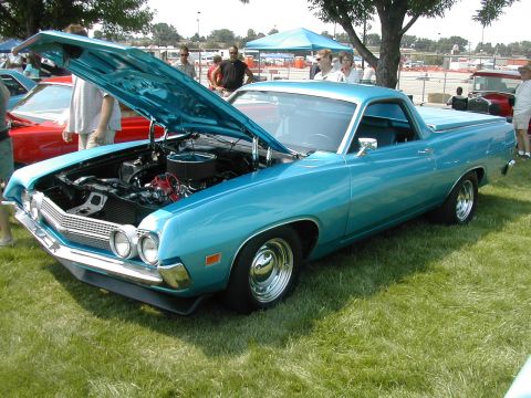1972 Ford Ranchero - A blue 1970 Ford Ranchero is displayed with its hood up at an outdoor car show.