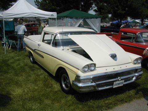 1972 Ford Ranchero - Two-tone 1959 Ford Ranchero at a car show, hood up, with a red car beside it.