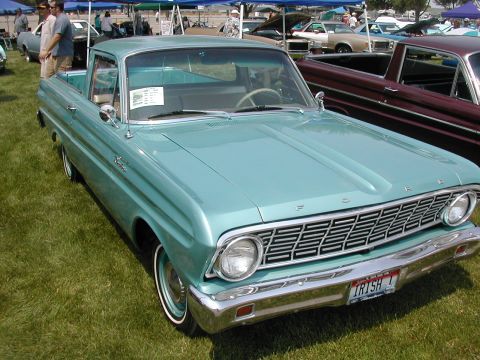 1972 Ford Ranchero - A light blue 1960 Ford Falcon Ranchero is displayed at an outdoor car show with other vehicles present.
