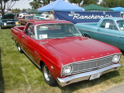 1972 Ford Ranchero - A red 1966 Ford Ranchero is displayed at a car show with other vehicles and tents in the background.