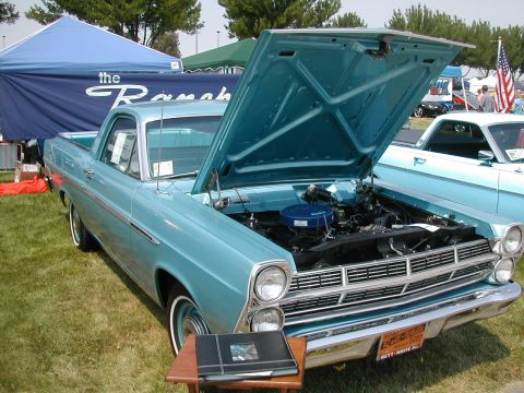1972 Ford Ranchero - A light blue 1966 Ford Ranchero is displayed with its hood open, revealing the engine, while another similar vehicle is visible in the back…