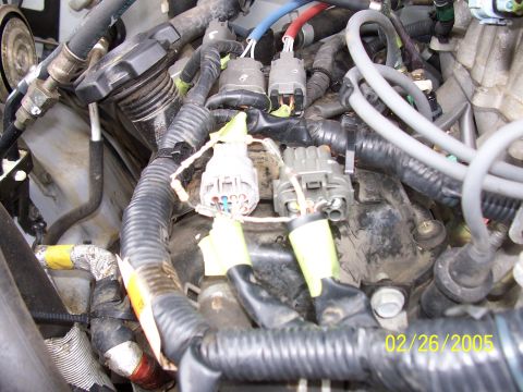 2000 Nissan Xterra - Engine bay wiring detail, showing connectors and insulation. The photo is dated February 26, 2005.