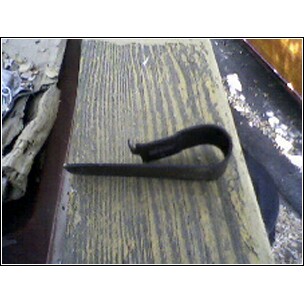 1972 Ford Ranchero - A close-up view of a metal clip on a wooden surface, with "SUPERMOTORS" text visible at the bottom.