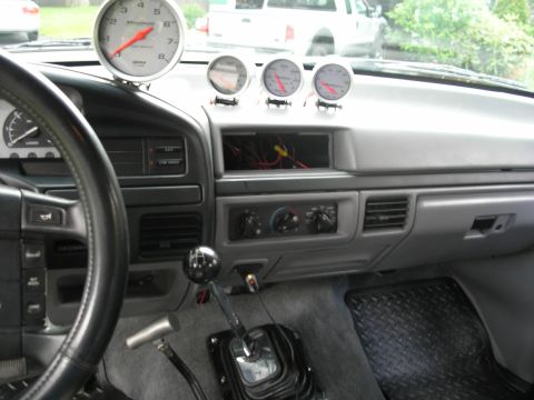 1994 Ford Bronco - Interior view of a 1994 Ford Bronco, aftermarket gauges mounted on the dashboard.
