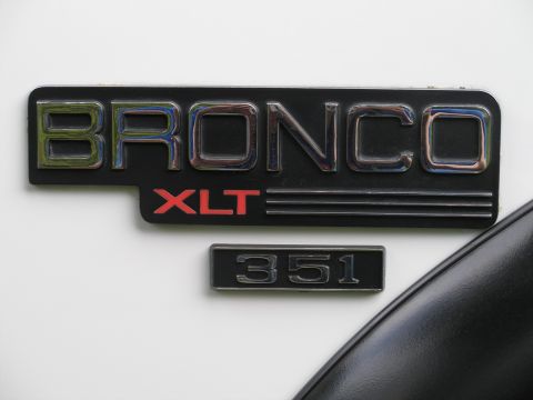 1994 Ford Bronco - Close-up of a Ford Bronco XLT badge with a 351 designation.