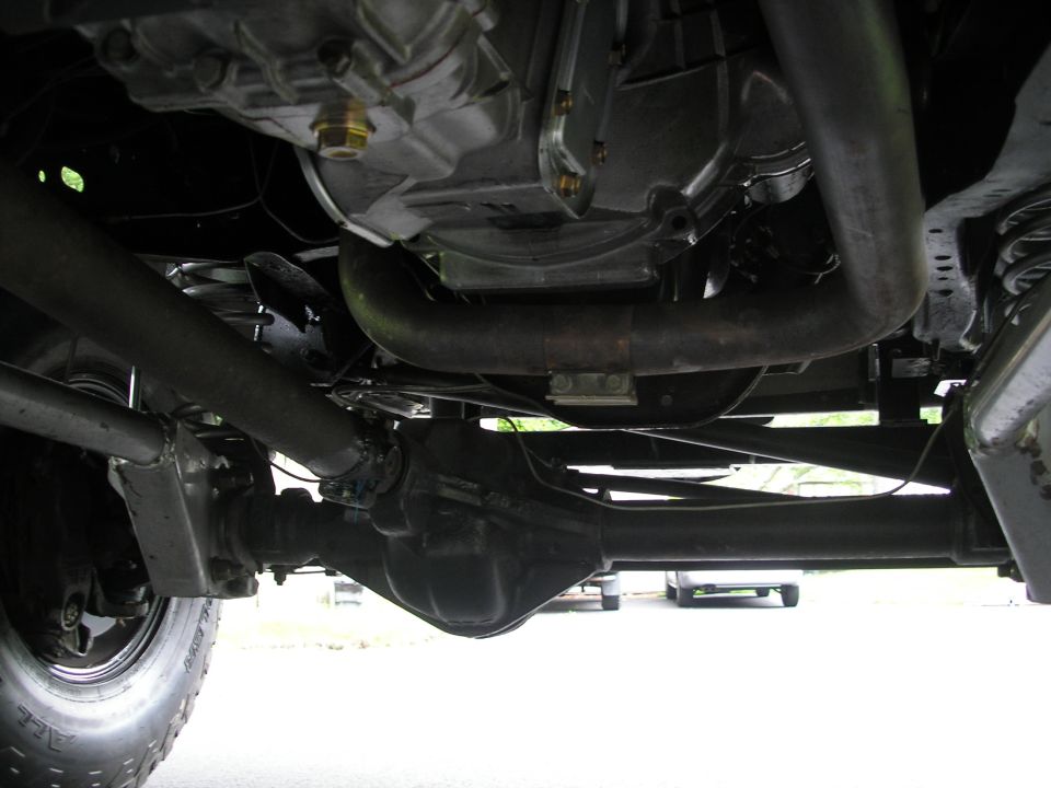 Undercarriage view showing drivetrain and exhaust system
