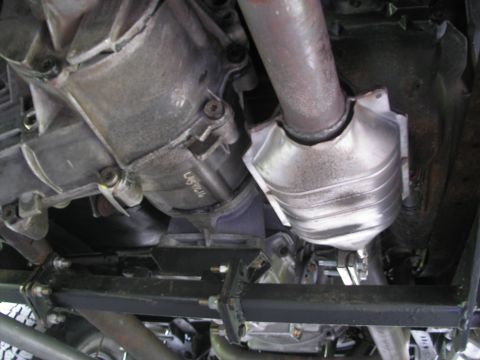 1994 Ford Bronco - Underside view of vehicle drivetrain components, including transmission and exhaust system.