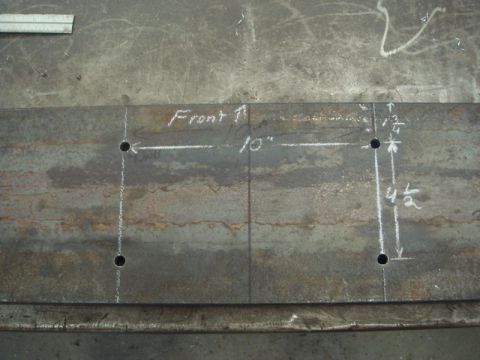 1996 Ford Bronco - Metal plate marked for drilling holes, indicating dimensions and orientation.