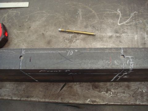 1996 Ford Bronco - A steel beam is marked for a winch installation, with measurements and drill points indicated.
