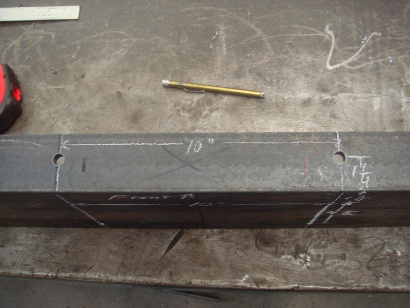 Steel beam with chalk markings for drilling holes and measurements