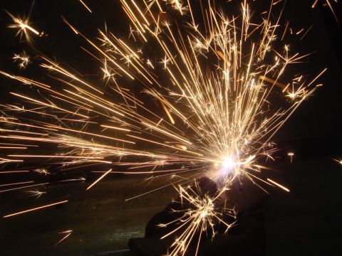 1996 Ford Bronco - Metal grinding creates a shower of sparks against a dark background.