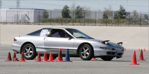 1993 Ford Probe - A silver 1993 Ford Probe is seen on an autocross course, marked with racing number 615.