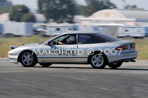 1993 Ford Probe - Silver 1993 Ford Probe captured in motion during an autocross event.