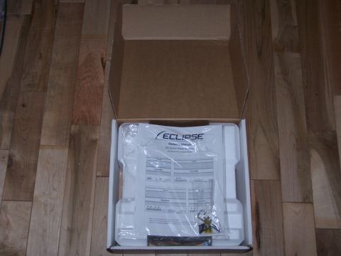 1995 Ford Probe - An Eclipse car stereo owner's manual is shown inside its original packaging.