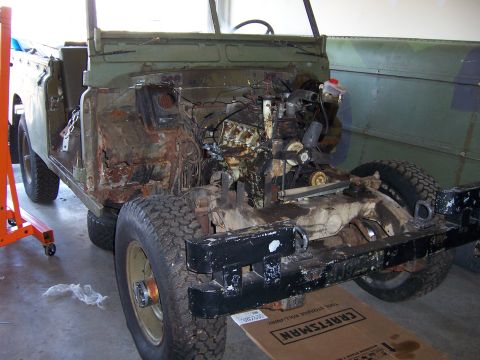 1974 Land Rover Land Rover - This Land Rover is missing its engine and has significant rust on the firewall, indicating a major restoration project.