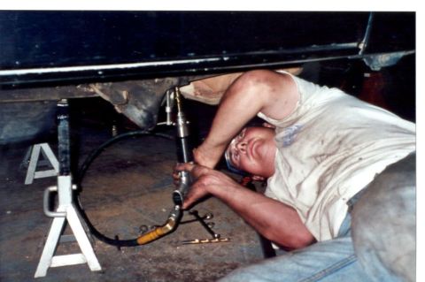 1989 Ford Bronco - Jon drilling thru the rivets that hold on the brackets