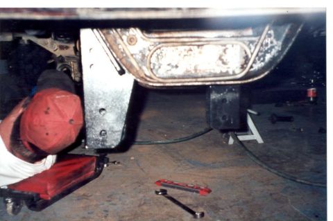 1989 Ford Bronco - Drilling out the radius arm brackets, you can also see the new lift brackets in the foreground
