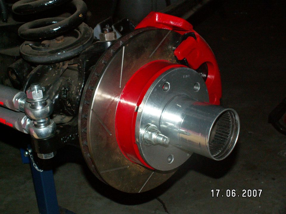 Slotted rotors, painted caliper and bracket, Jet-Hot (exhaust coatings) coated original hubs (24yr old) and upgrade to 9/16 wheel studs