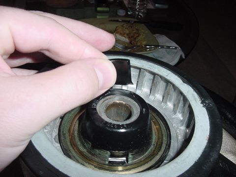 1989 BMW 3 Series - Close-up of a hand interacting with an unidentified automotive component.