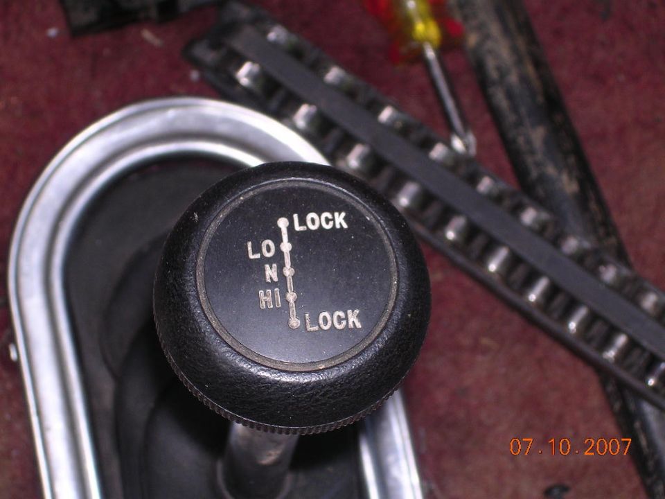 Transfer case shifter knob with LO, N, HI, and LOCK positions marked