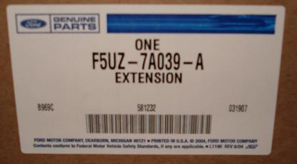 1999 Ford Crown Victoria - Close-up of a Ford Genuine Parts box label reading "ONE F5UZ-7A039-A EXTENSION" with a barcode, lot numbers 581232 and 031907, and Ford Mot…