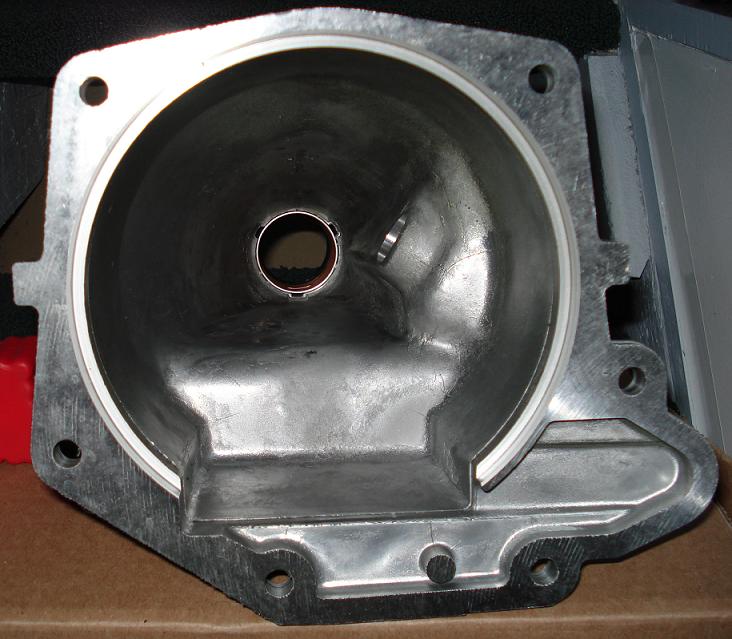 Inside an aluminum transmission extension housing looking through to the bronze tail bushing