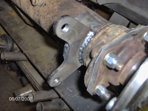 1978 Ford Bronco - Close-up of a rear axle assembly showing a newly welded brake caliper bracket.